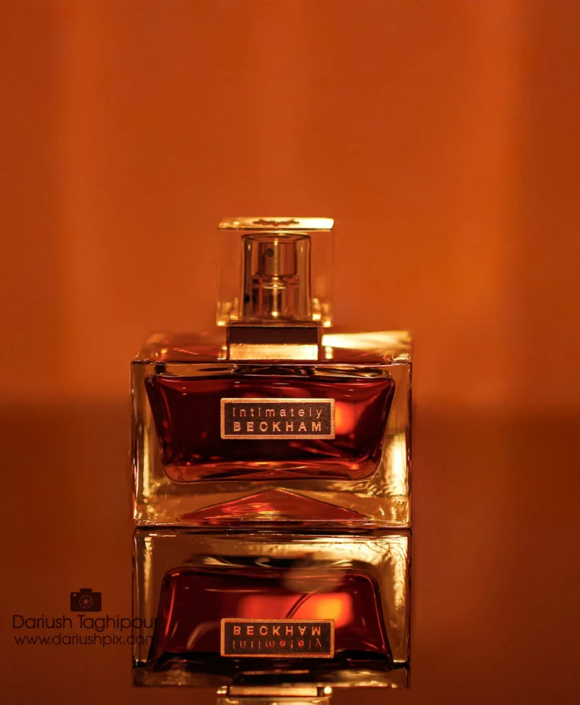 The Art of Fragrance & Beauty. Capturing the essence of luxury through high-end product photography, focusing on elegant bottle design, light play, and refined beauty aesthetics.